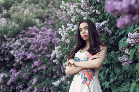 Girl in a long dress walking in the botanical gardenの写真素材
