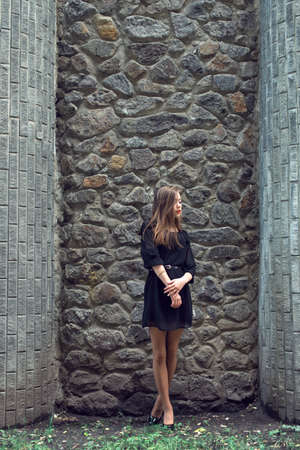 Young girl in vintage black dressの写真素材