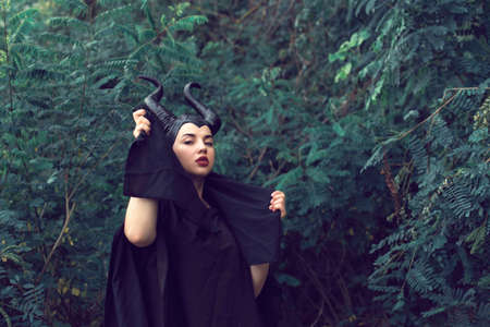 A young girl in a fairy tale suit