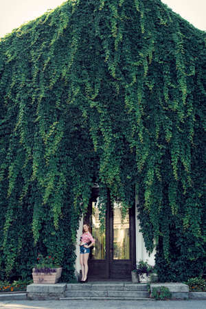 Walk with a red haired girl in retro styleの写真素材