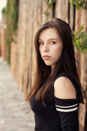 Summer city walks with a young brunetteの写真素材