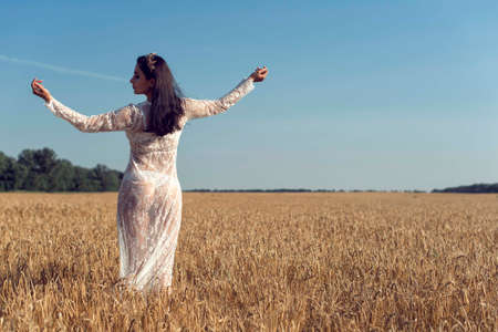 Summer walk in the countryside with a girlの写真素材
