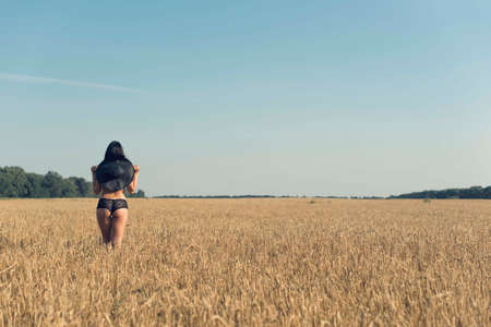 Summer walk in the countryside with a girlの写真素材