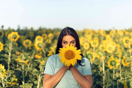 Summer walk in the countryside with a girlの写真素材
