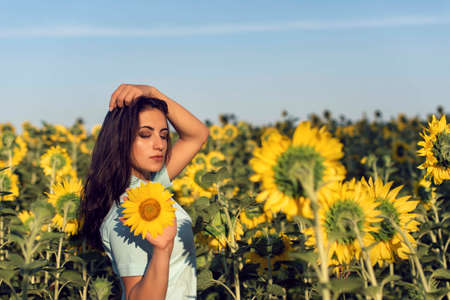 Summer walk in the countryside with a girlの写真素材