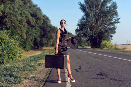 Summer walk in the countryside with a girlの写真素材