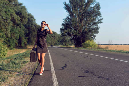 Summer walk in the countryside with a girlの写真素材