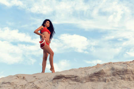 Beautiful brunette with long black curly hairの写真素材