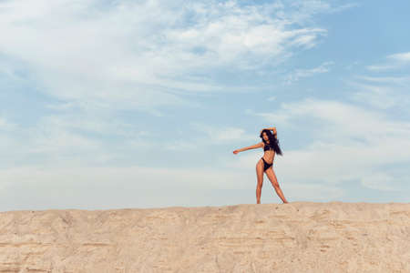 Beautiful brunette with long black curly hairの写真素材