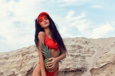 Beautiful brunette with long black curly hairの写真素材