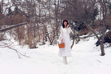 pretty girl adventures in the winter forestの写真素材