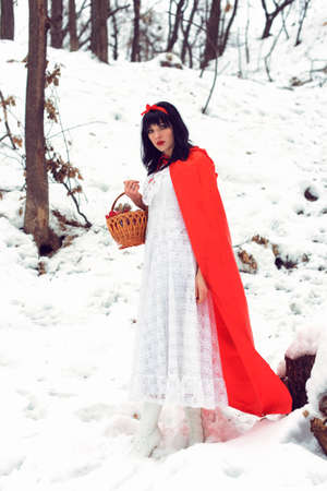 pretty girl adventures in the winter forestの写真素材