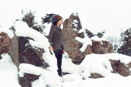 In the park with a girl in snowy weatherの写真素材