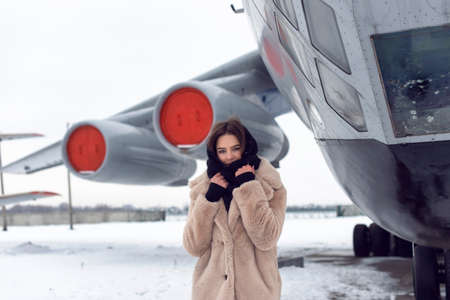 Tourist girl in winter at the airport