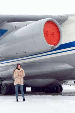 Tourist girl in winter at the airport