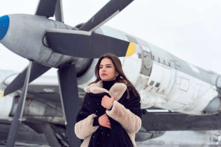 Tourist girl in winter at the airport