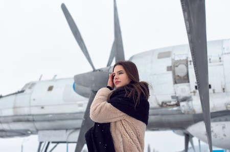 Tourist girl in winter at the airport