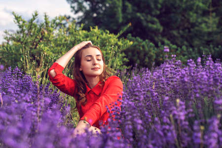 Walk with a young girl in the summer botanical gardenの写真素材