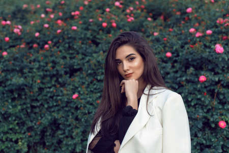 Young brunette in stylish modern clothesの写真素材