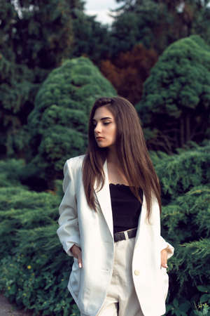 Young brunette in stylish modern clothesの写真素材