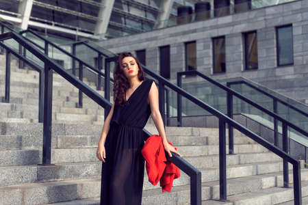 Spring walk in the city in fashionable clothesの写真素材