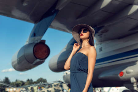Brunette in a dress at the old airport