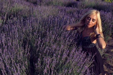 Mature blonde in the summer botanical gardenの写真素材