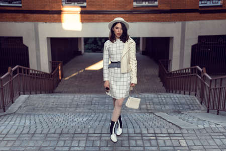 Stylish young girl in an autumn lookの写真素材