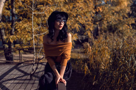 Walk with a brunette in the autumn parkの写真素材