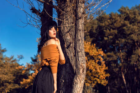 Walk with a brunette in the autumn parkの写真素材