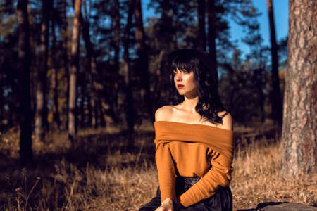 Walk with a brunette in the autumn parkの写真素材