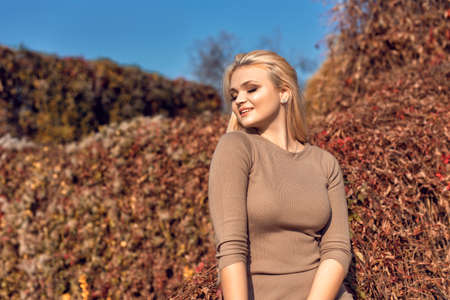 Autumn walk in the park with a cute blonde