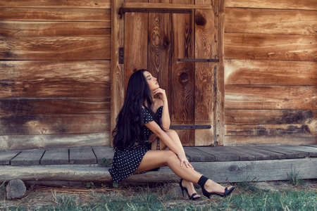 Photoshoot with a brunette in an old villageの写真素材