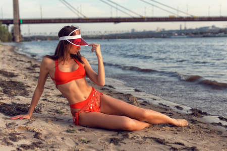 Athletic young girl on a city beachの写真素材