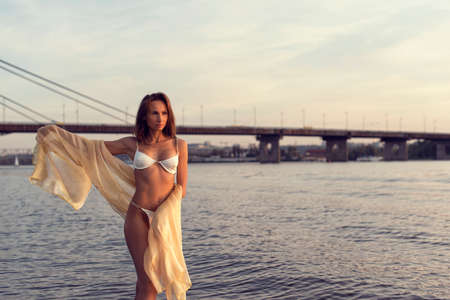 Athletic young girl on a city beachの写真素材
