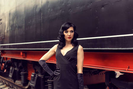 Young girl at the retro train station