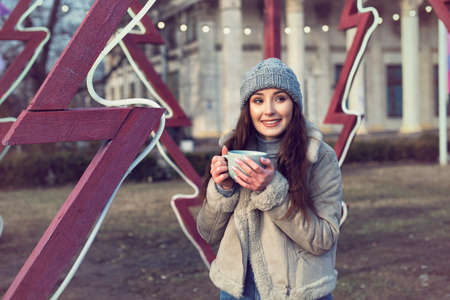 Winter walk with a young pretty girlの写真素材