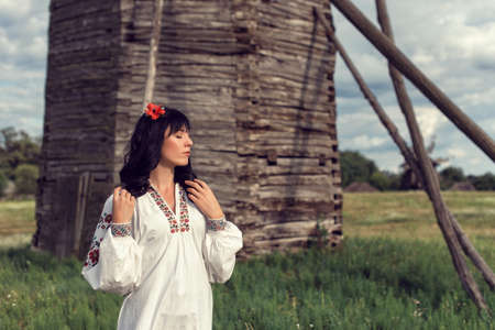 Girl in a folk costume in a national park