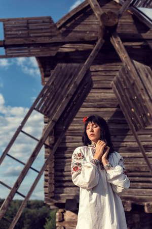 Girl in a folk costume in a national parkの写真素材