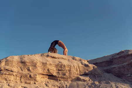 Walking in nature with a young curly blondeの写真素材