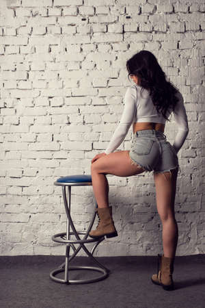 Girl with an athletic figure in the studioの写真素材