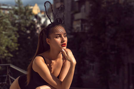 Young girl with red lips in studioの写真素材