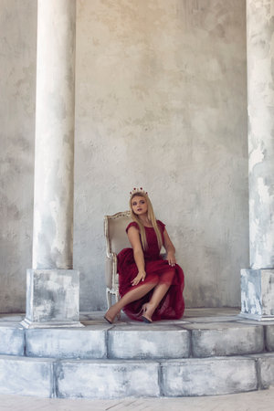 Young blonde in a beautiful dress