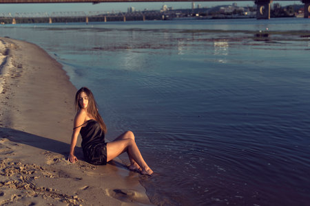 Evening photo shoot on the beach by the riverの写真素材