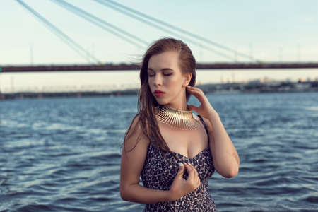 Chubby girl on the evening beach