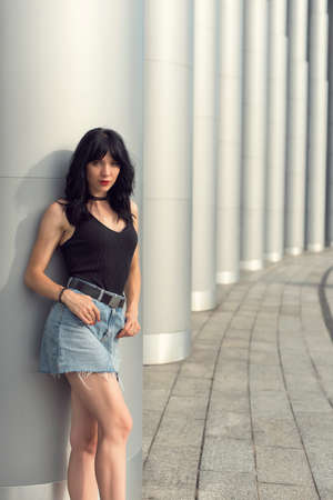 Brunette near the building with columns