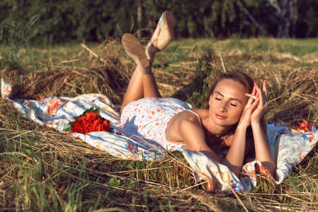 Walking with a young woman in the parkの写真素材