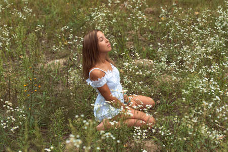 Young woman in short white dress