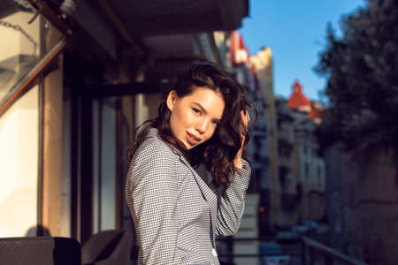 Walking with a brunette in a summer city