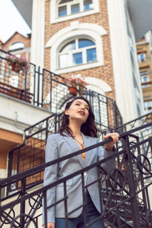 Walking with a brunette in a summer cityの写真素材